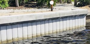 Vinyl seawall with concrete cap