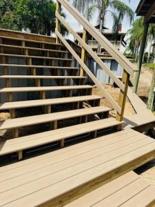 Composite decking staircase for double level seawall installation